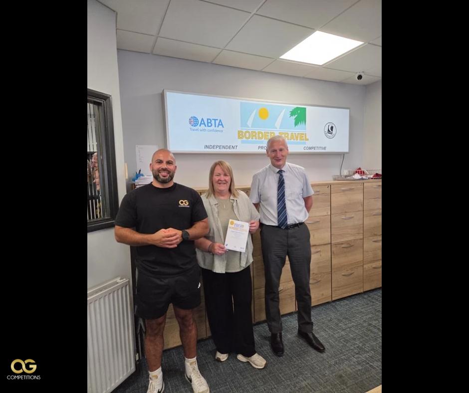 An OG Competitions winner with their prize
