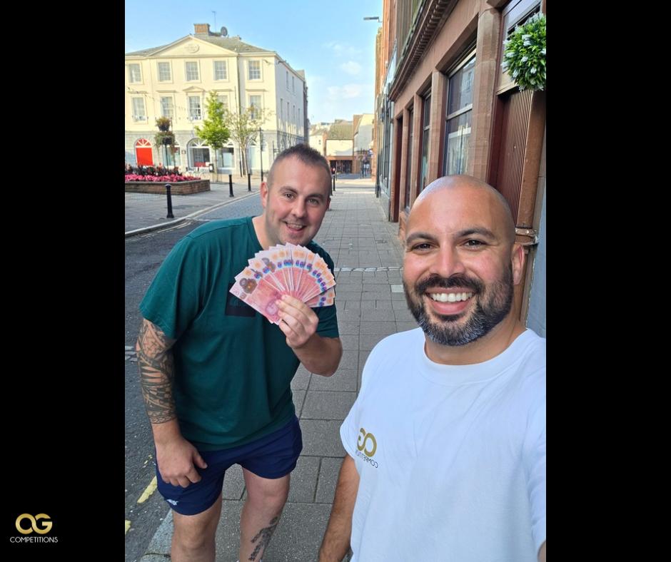An OG Competitions winner with their prize
